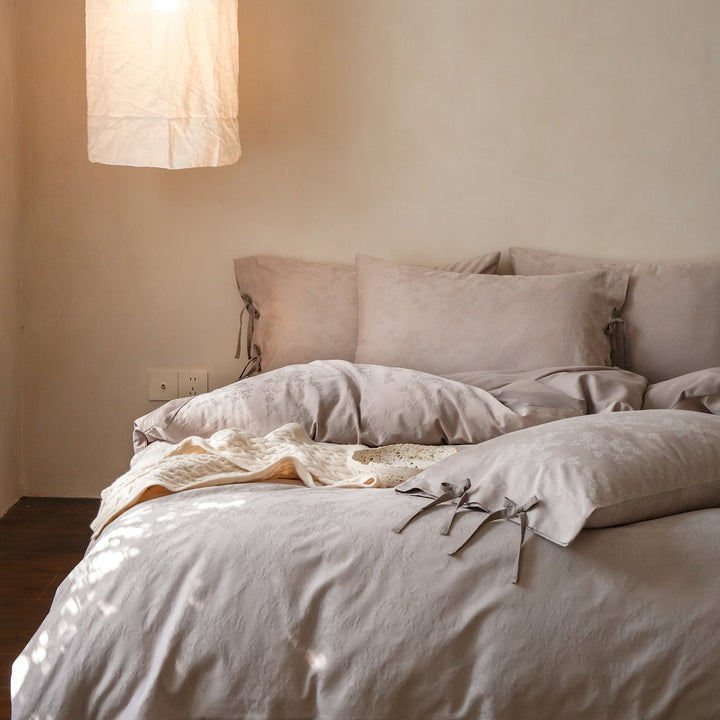 Fine cotton bedding set with jacquard floral pattern and side decorative ribbons