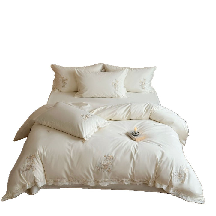 Fine cotton satin bedding set with floral relief embroidery and delicate lace edge