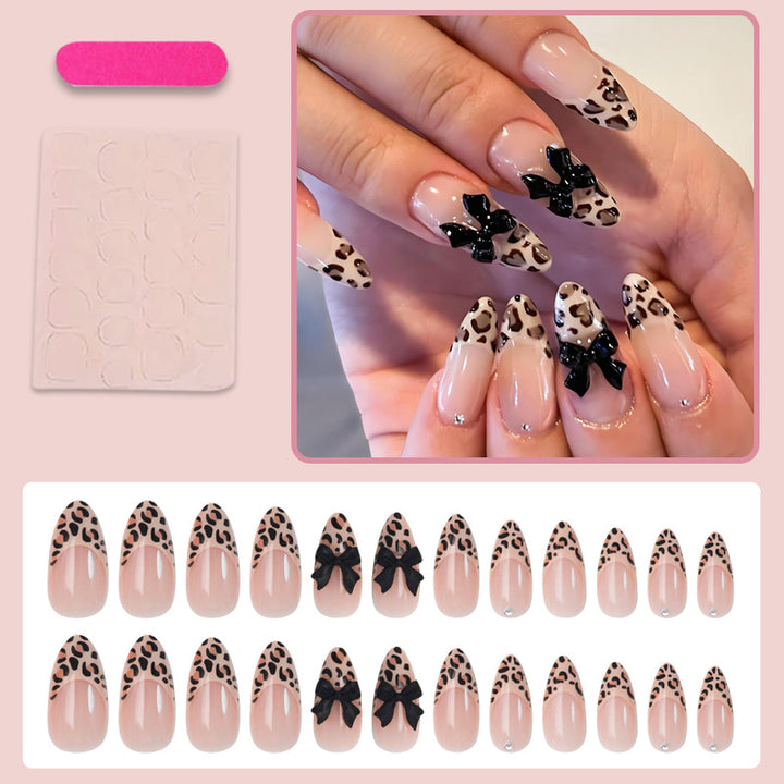 Animal-themed artificial nail set with elegant bows Stornfield