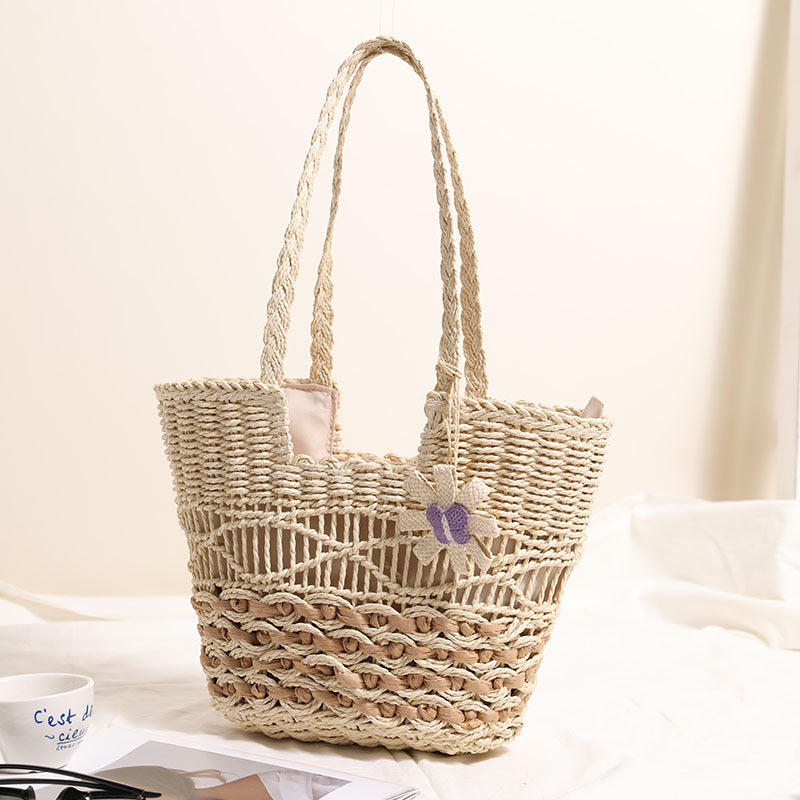 Braided basket bag with decorative flower appliqué Stornfield