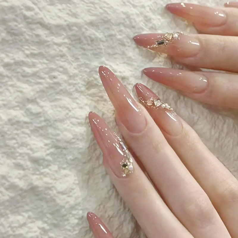 Artificial nail set with elegant ombre effect and glamorous embellishments Stornfield