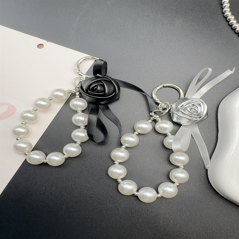 Elegant Pearl and Leather Charm Keychain Stornfield