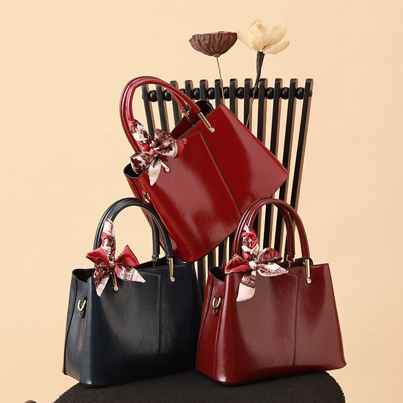 Stylish Structured Handbag with Decorative Scarf