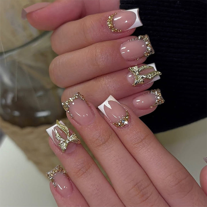 Nail art set with elegant glitter ornaments and stylish French tips Stornfield