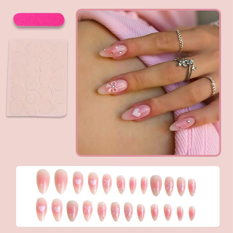 Artificial nail set with delicate bow embellishments Stornfield