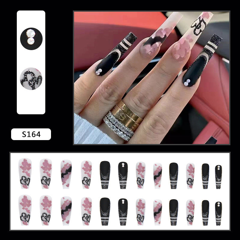Artificial nail set with creative 3D elements and sparkling accents Stornfield