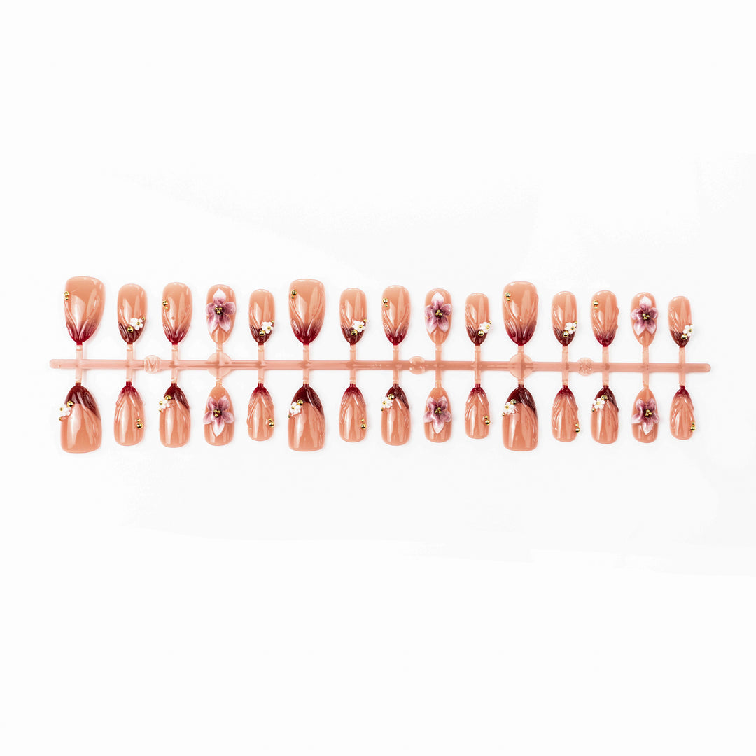 Artificial nail set with floral accents and gold embellishments Stornfield