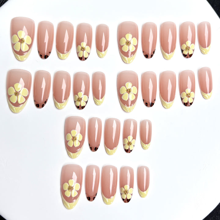 Artistic Press-On Nail Set with Floral Embellishments