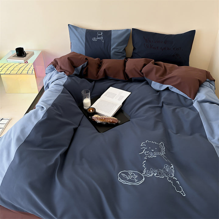 Reversible bedding set with contrasting inserts and fine line embroidery