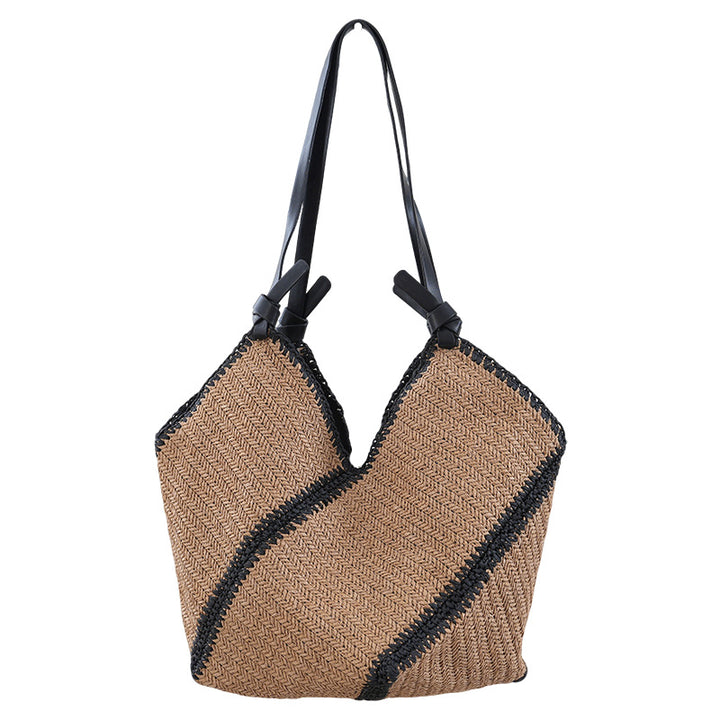 Handbag made of braided natural material with contrasting leather handles Stornfield