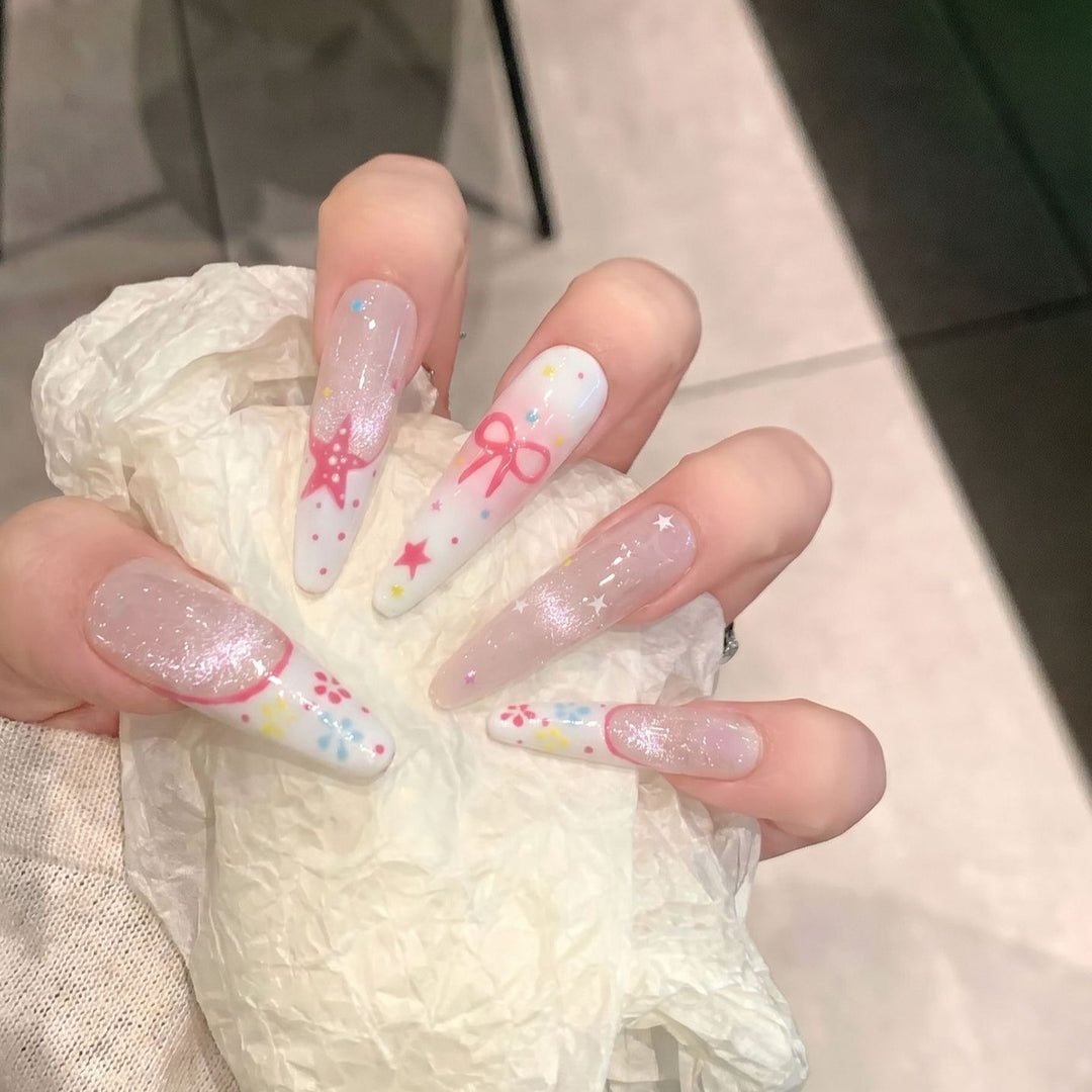 Artistic Press-On Nail Art Set with Charming Star and Bow Designs Stornfield