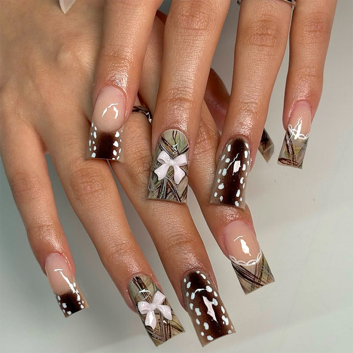 Artificial nails with elegant bow and pattern design Stornfield