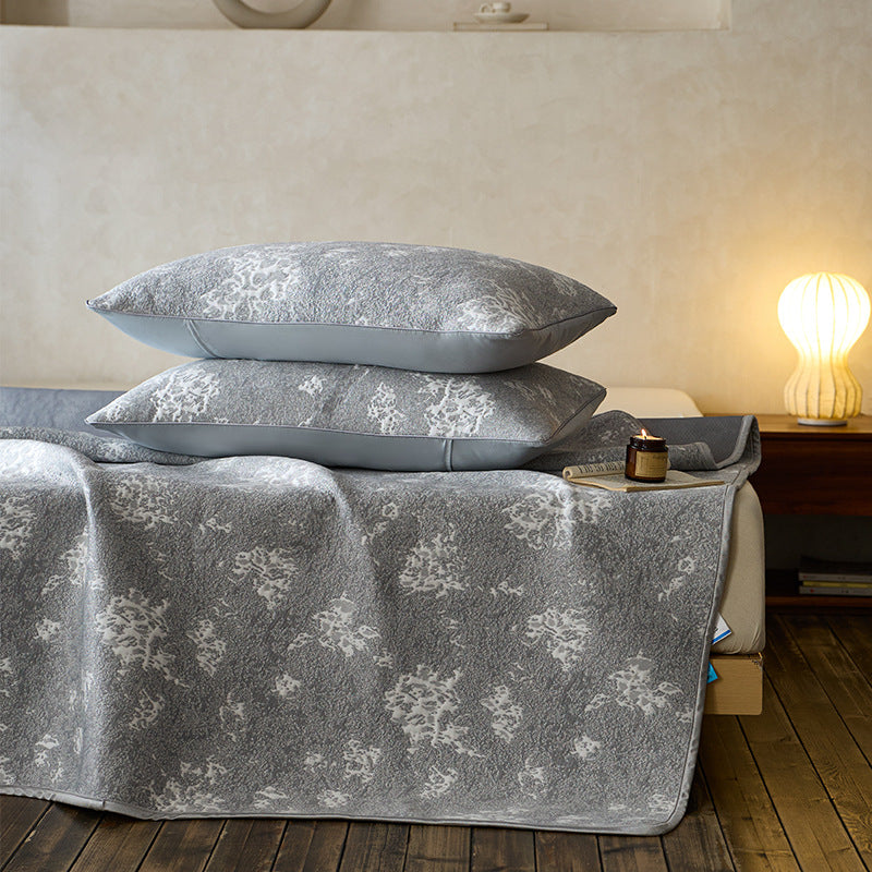 Quilted microfiber mattress pad with non-slip bottom and floral jacquard surface