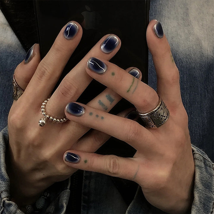 Acrylic nail set with luxurious gradient and modern accents Stornfield