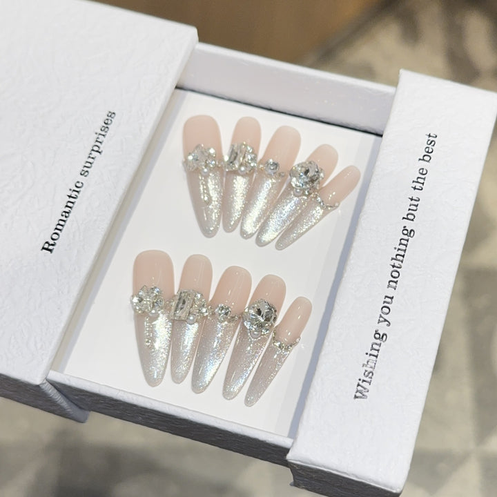 Glamorous artificial nails with sparkling rhinestone embellishments Stornfield