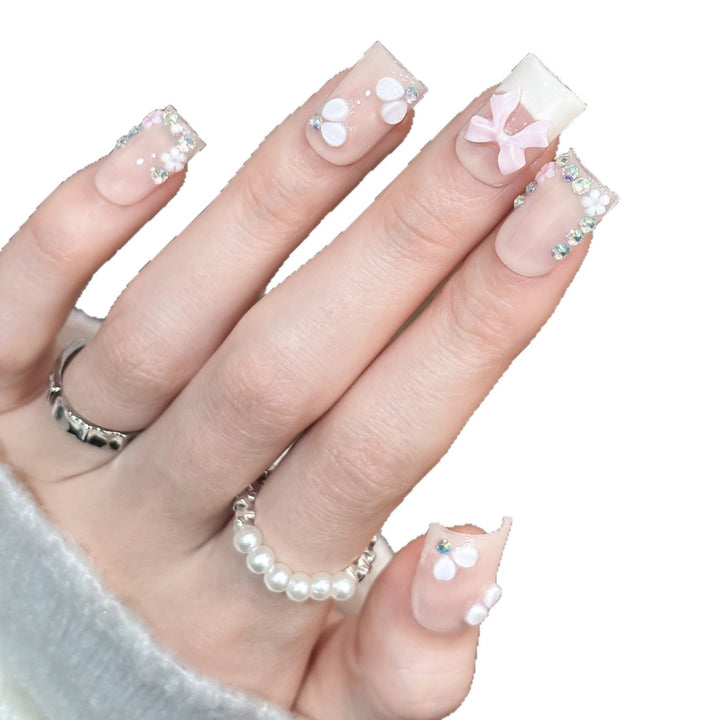 Decorative Nail Art Set with Floral Details and Bow Accents