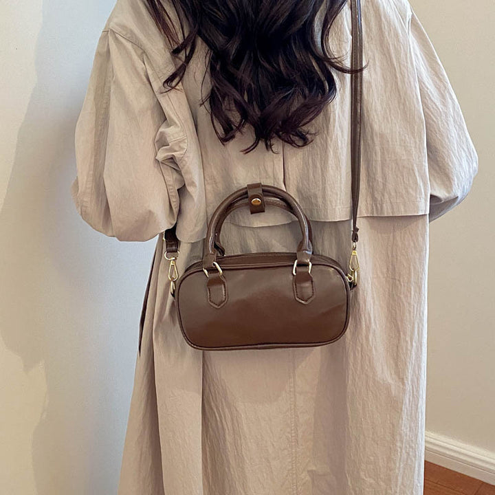 Vintage-Inspired Glossy Handheld Satchel