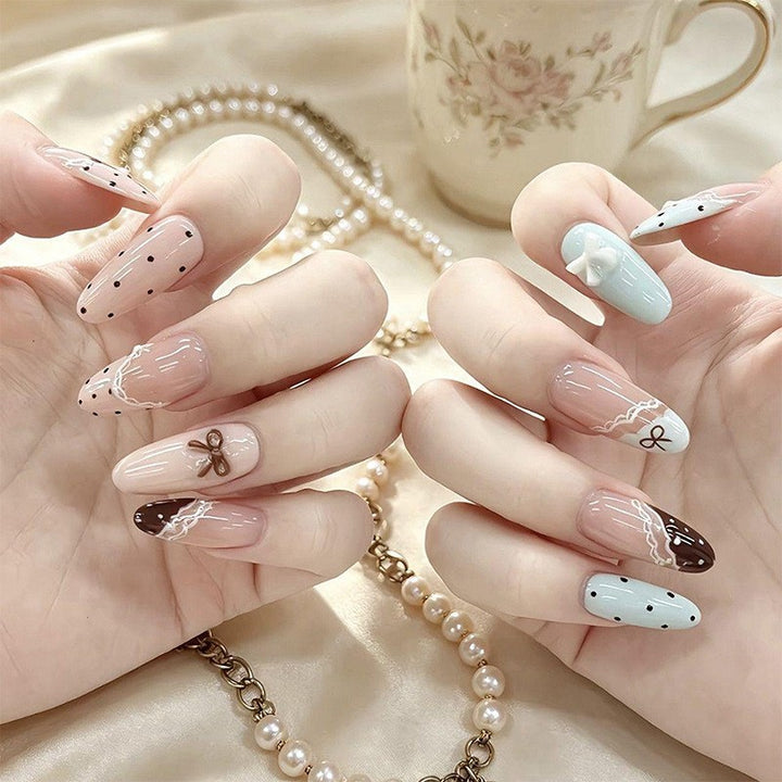 Artificial nail set with elegant accents and fine designs Stornfield