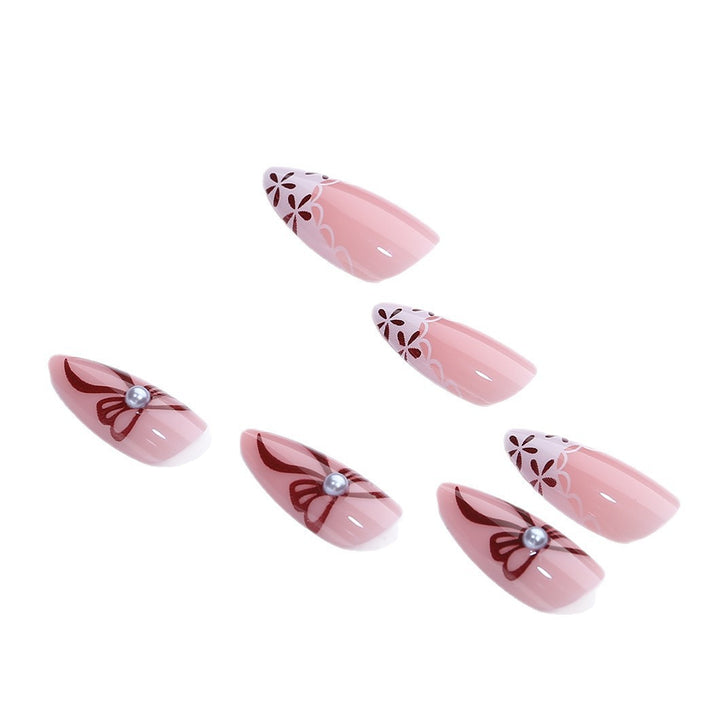 Elegant artificial nail design with floral accents Stornfield