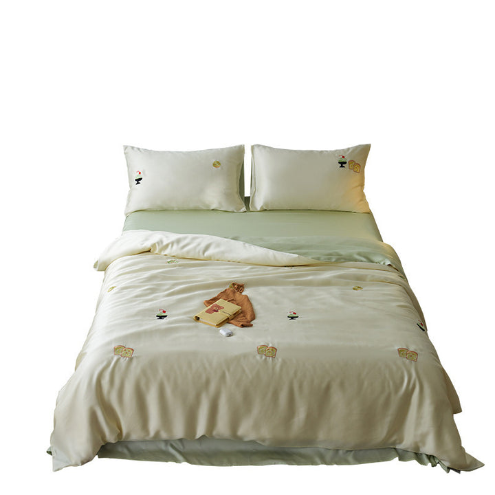 Reversible cotton satin bedding set with fitted sheet and subtle embroidery appliqués