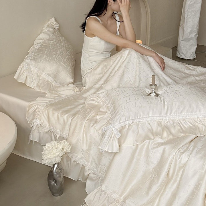Satin bedding set with jacquard bow relief, gathered ruffle and lace trim
