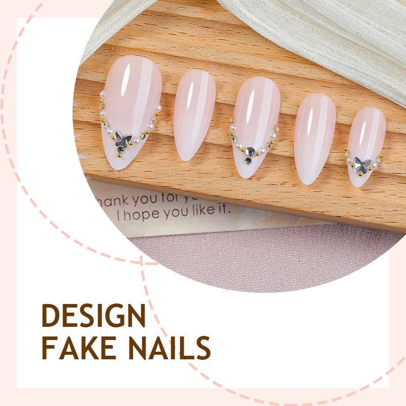 Acrylic nail set with elegant rhinestone decorations and glamorous designs Stornfield