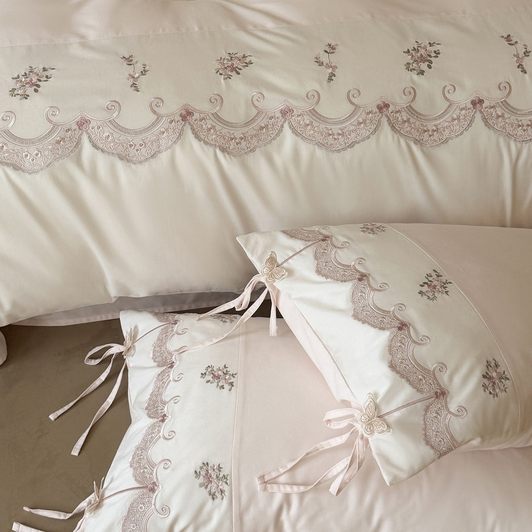 Luxurious embroidered satin bedding set with ruffled hem