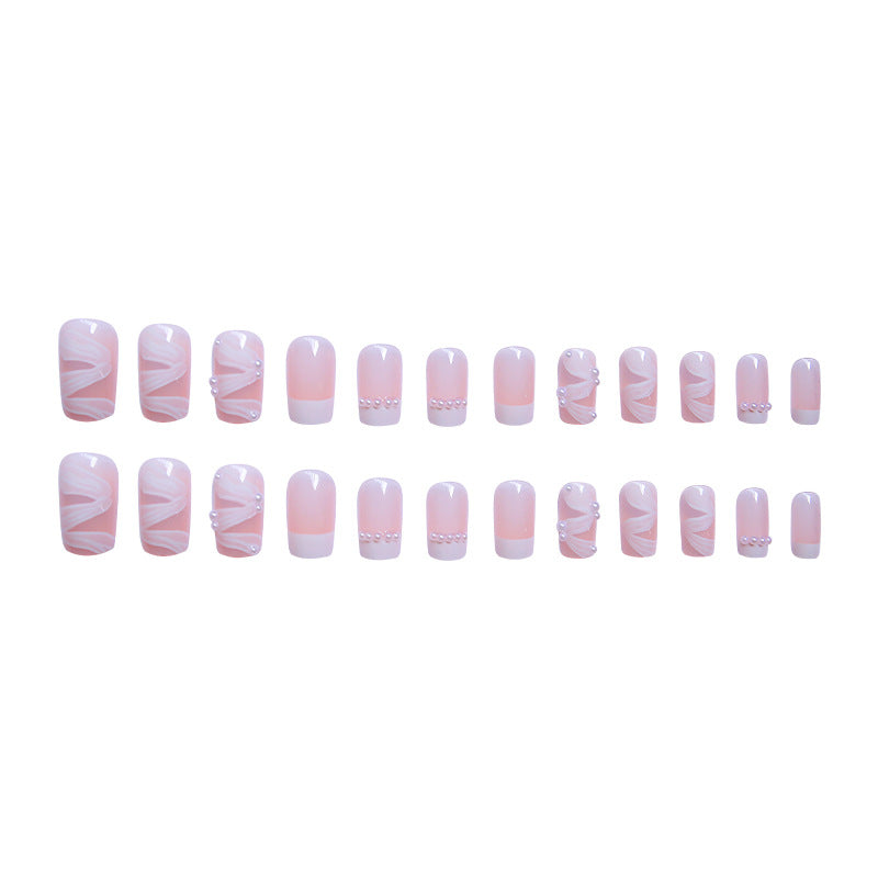 Elegant artificial nail set with stylish wave pattern and pearl accents Stornfield