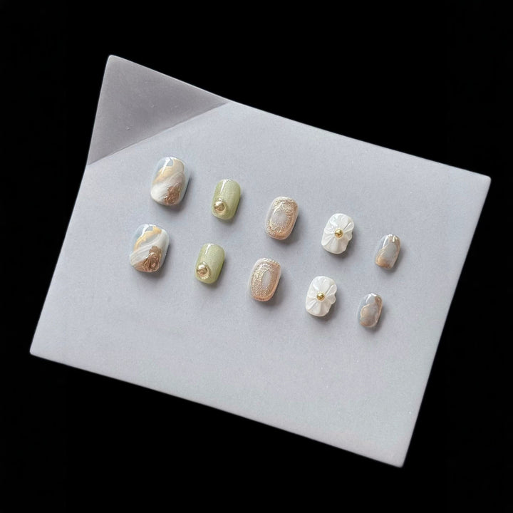 Premium Press-On Nail Art Set with Floral and Metallic Accents