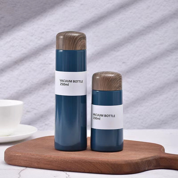 Women vacuum-insulated water bottle with innovative wooden lid Stornfield