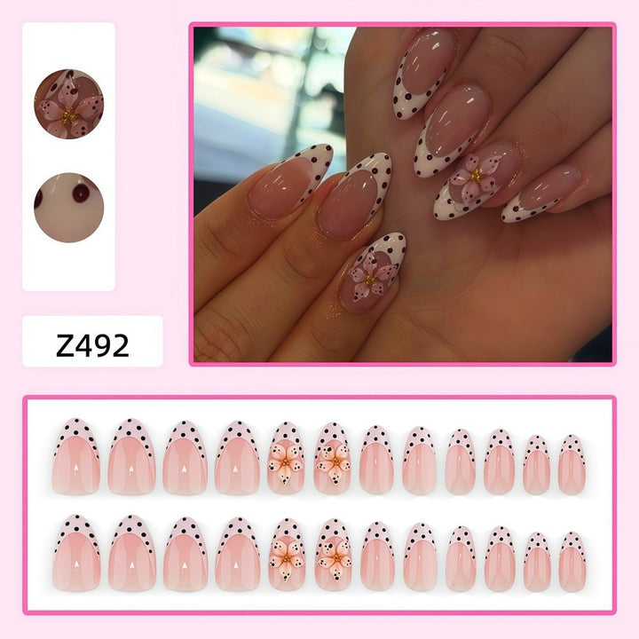 Creative artificial nails with floral design and glamorous accents Stornfield