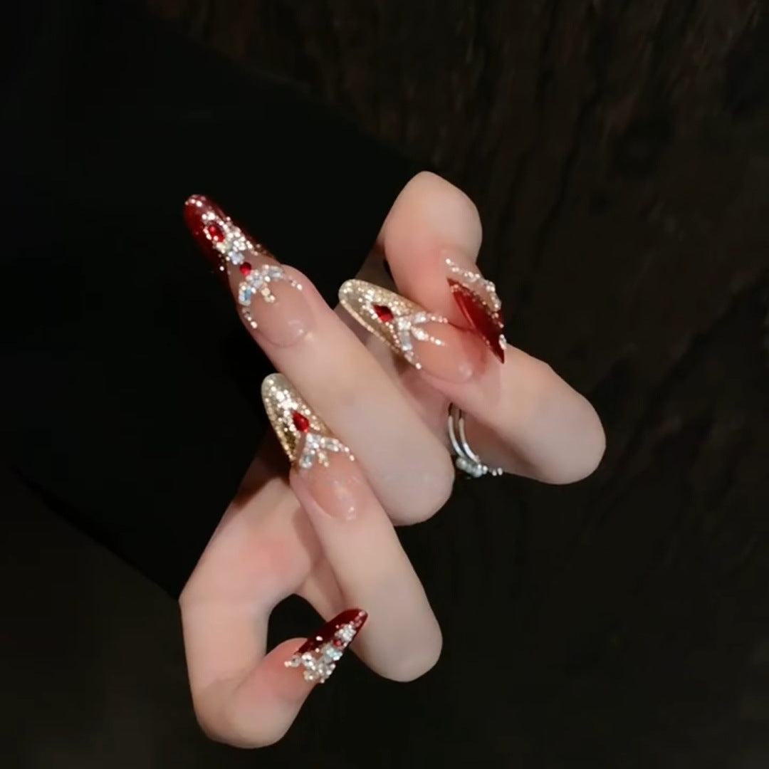 Artificial nail tips with sparkling crystal embellishments Stornfield