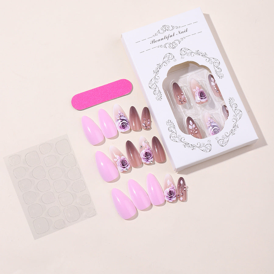 Creative nail art set with elegant rose accents and soft color gradient Stornfield
