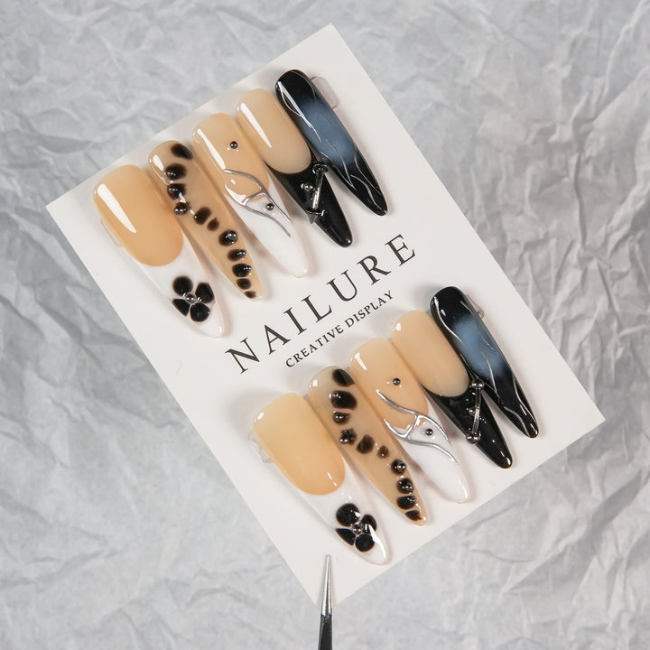 Artistic Stiletto Press-On Nails with Unique Patterning
