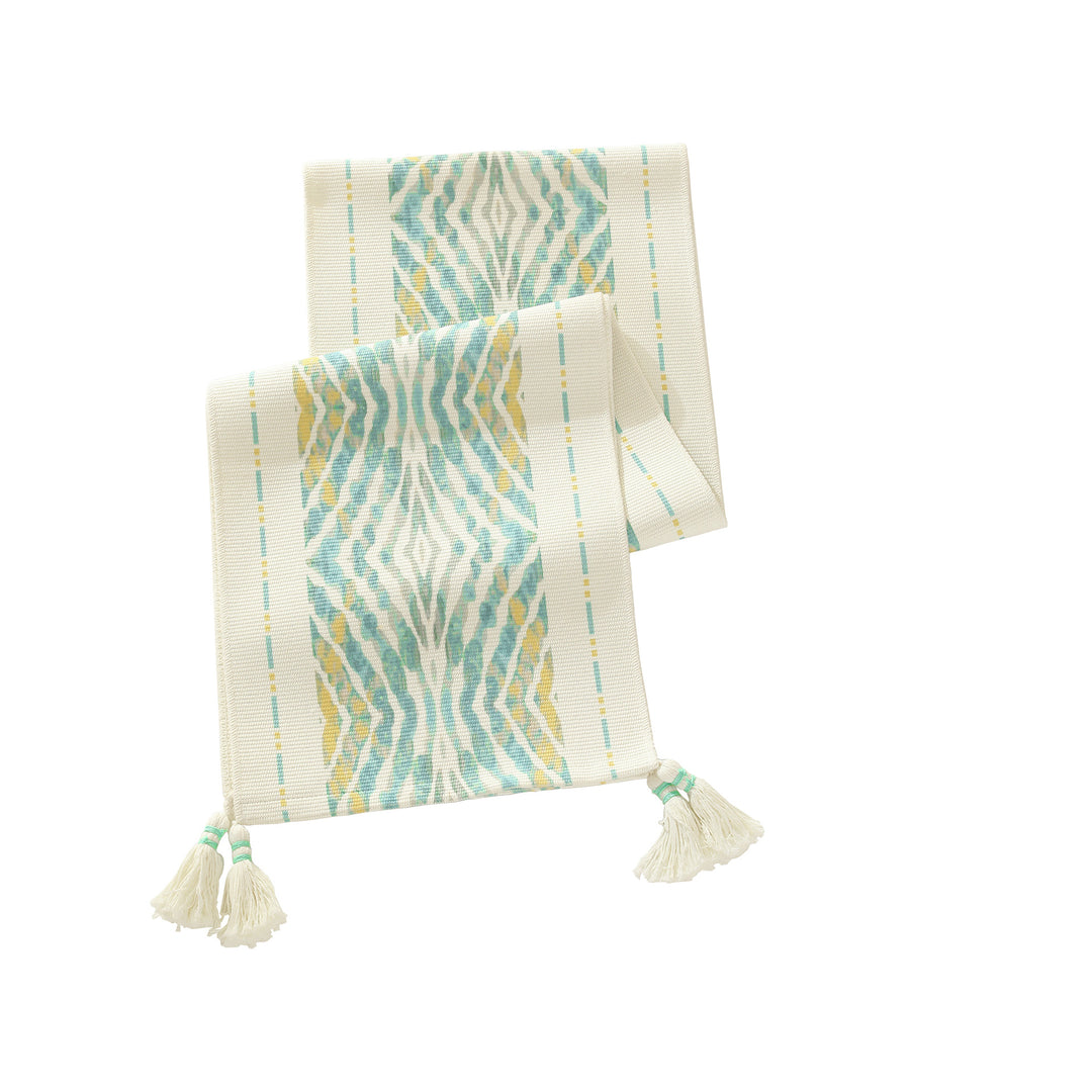 Web table runner made of cotton blend with woven diamond design and tassels