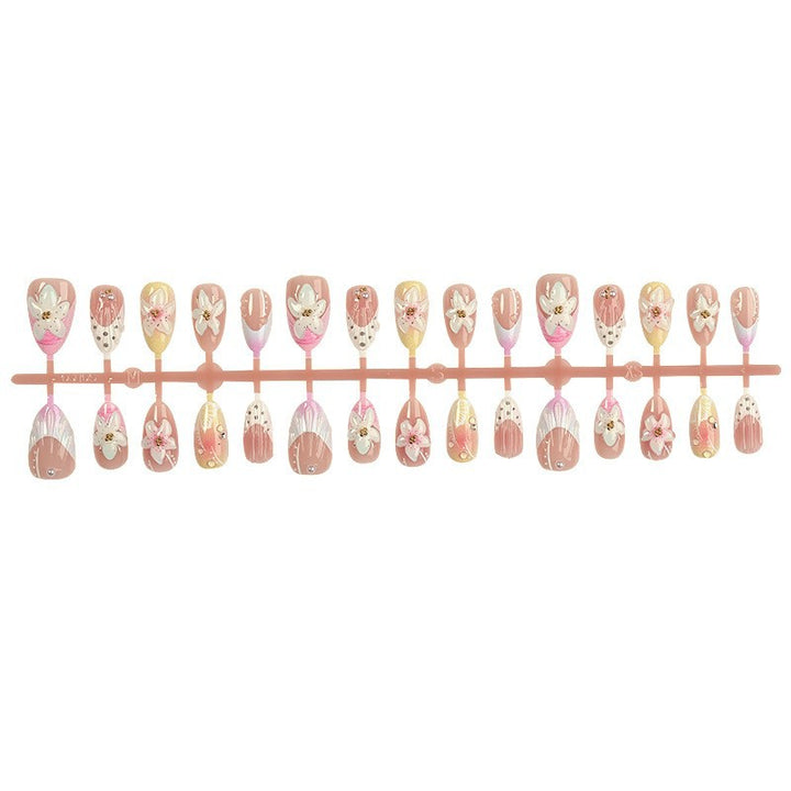 Nail art set with elegant floral design and glitter accents Stornfield