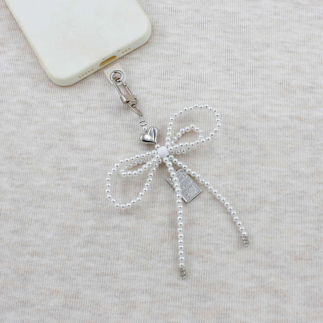 Elegant Beaded Bow Brooch Stornfield