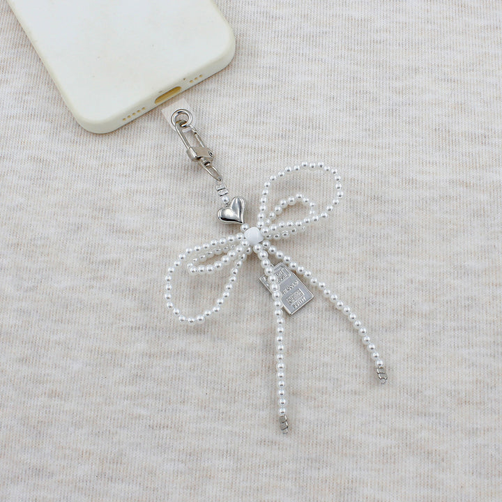 Elegant Beaded Bow Brooch Stornfield