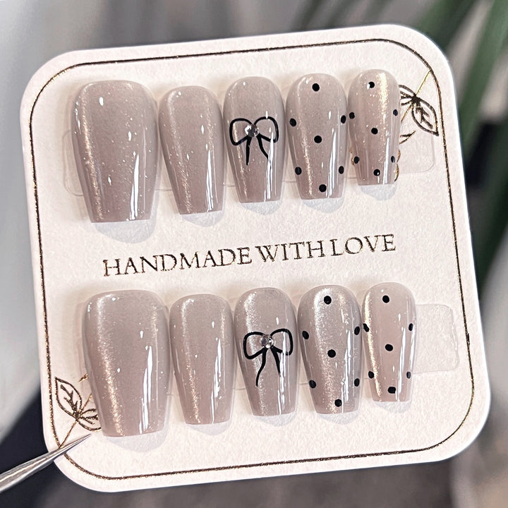 Artful Nail Extensions with Colorful Bow Motifs Stornfield