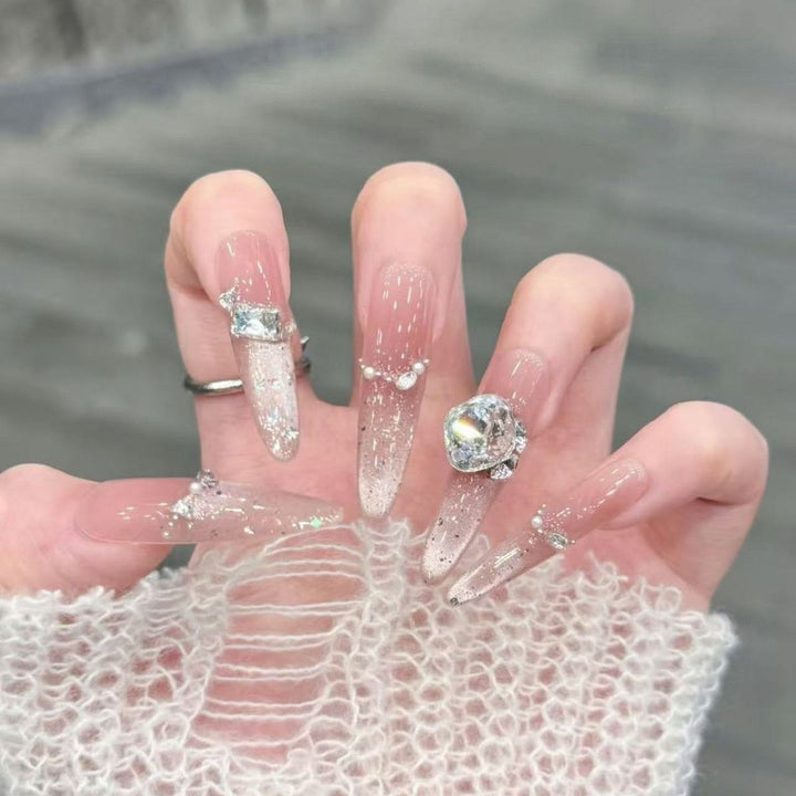 Artistic Stiletto Press-On Nail Art with Glimmering Accents Stornfield