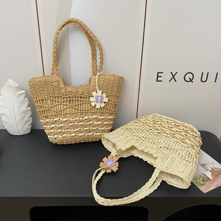 Handwoven beach bag with floral accents Stornfield