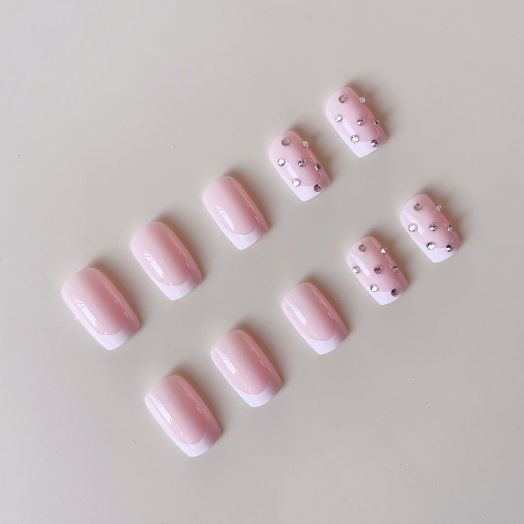 Artificial nail set with elegant rhinestones and French tip decorations Stornfield
