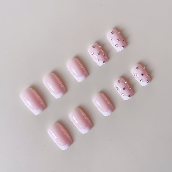 Artificial nail set with elegant rhinestones and French tip decorations Stornfield