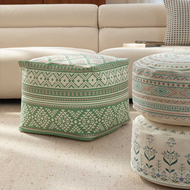Round floor pouf with ethnic weaving pattern and practical carrying handle Stornfield