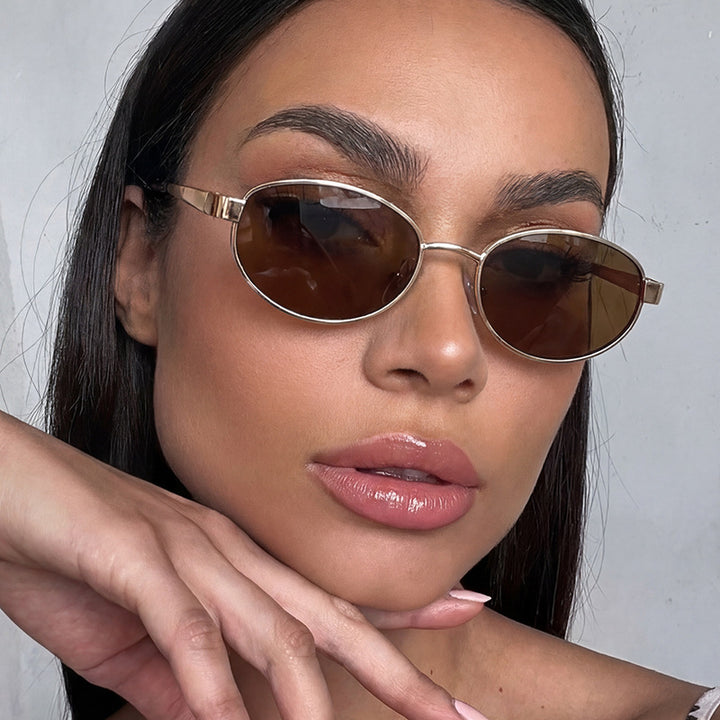 Women's fashionable sunglasses in an elegant oval design with a high-quality metal frame Stornfield