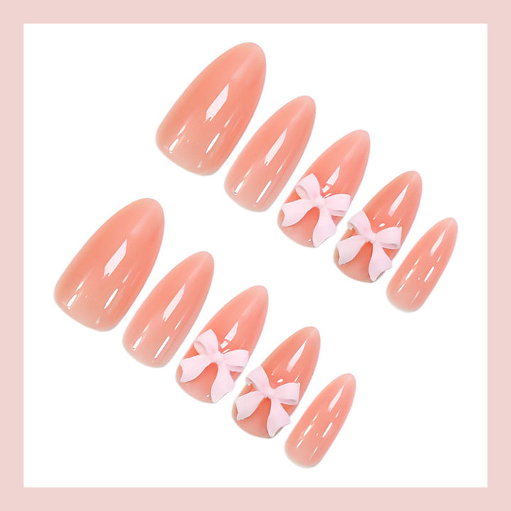 Artificial nail set with delicate bow embellishments Stornfield