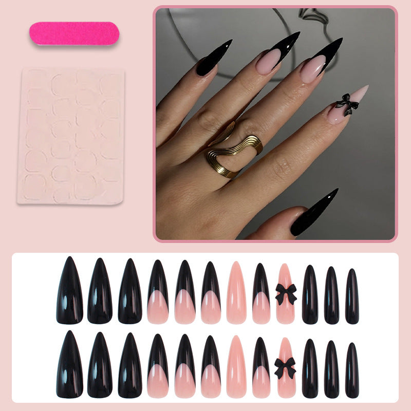 Acrylic nail set with elegant black-and-white design and playful accents Stornfield