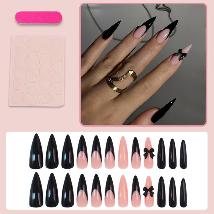 Acrylic nail set with elegant black-and-white design and playful accents Stornfield