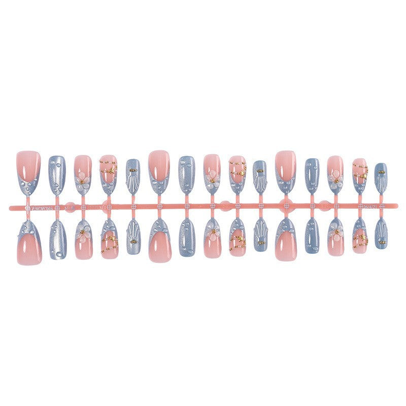 Creative acrylic nail set with elegant flower and glitter accents Stornfield