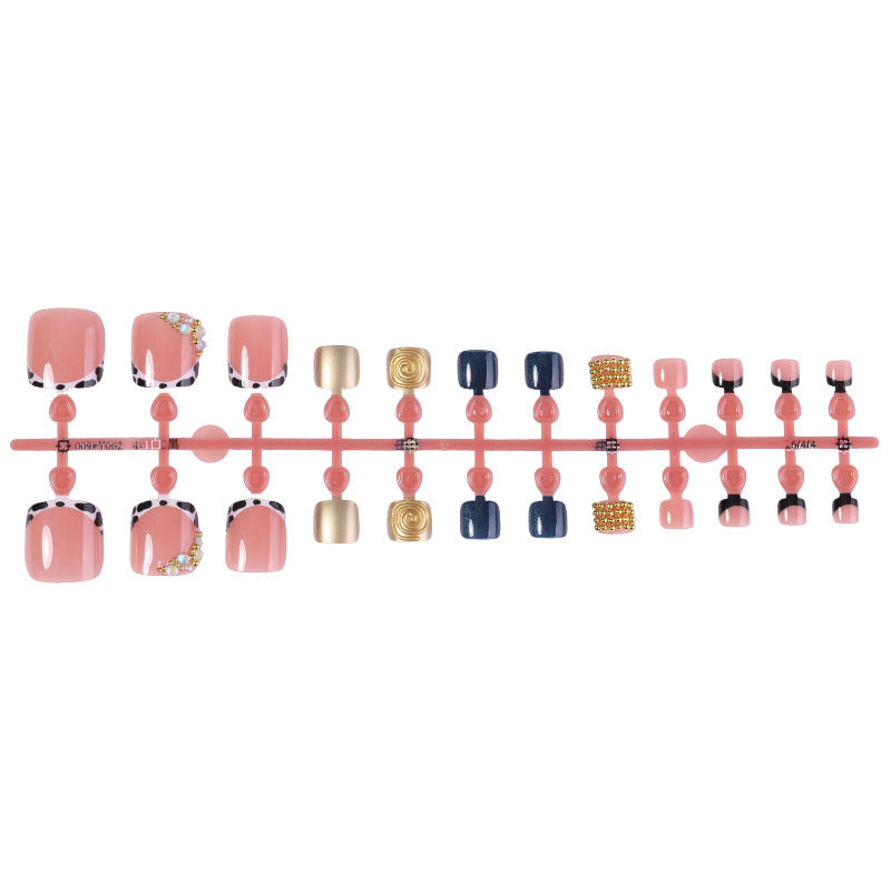 Acrylic nail set with luxurious golden embellishments Stornfield